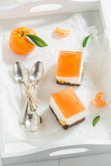 Sweet cheesecake made of jelly and fresh mandarin