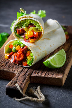 Closeup of burrito made of lettuce and vegetables