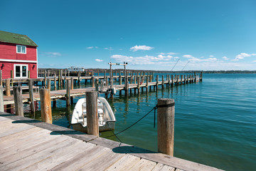 Fototapeta premium House and Wooden dock or pier by the lake with sky and cloud in 