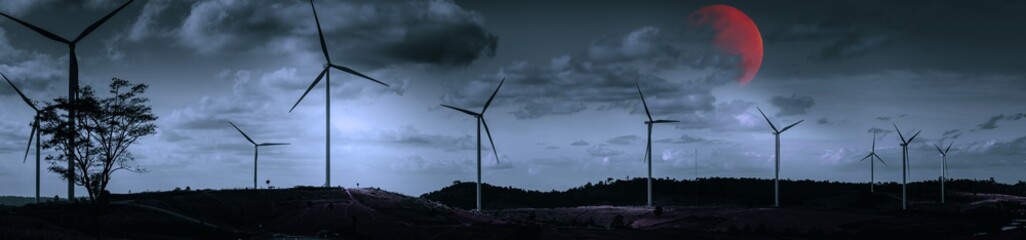 Halloween moon and sky concept from panorama view of wind turbine construction in field and meadow...