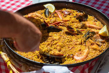 Typical  seafood paella in the traditional fry pan (Ibiza, Spain)