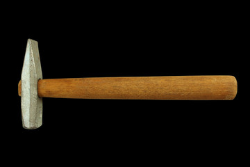 A small hammer with a wooden handle. Close-up. Isolated on a black background. Isolate.