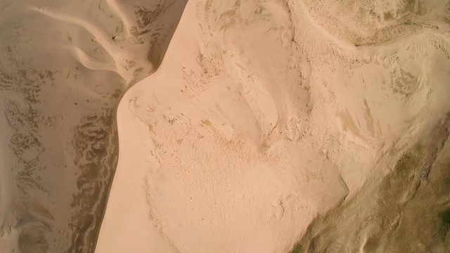 Panoramic movement in the sand.  Flight over the barkhans in the desert.