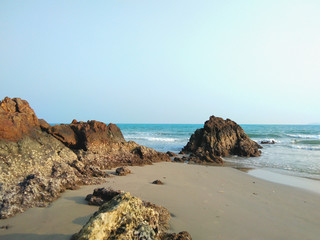 Beautiful landscape of the rocky beach and sea wave in Thailand