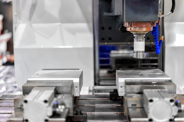 High precision CNC machining center working, operator machining automotive sample part process in factory