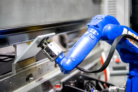 Hand robot working automatic cutting and bending metal sheet by high precision metal sheet bending machine, cnc control metal sheet bending machine in factory
