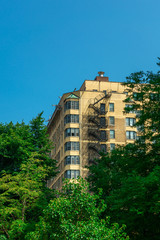 Apartment Building with a Fire Escape Framed by Trees in Chicago