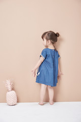 Back view of girl standing .