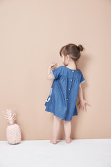 Back view of girl standing .