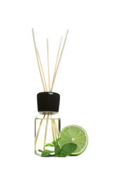 Obraz premium Aromatic reed air freshener and lime on white background