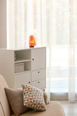 Stylish room interior with Himalayan salt lamp
