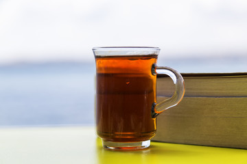 Enjoying tea at the seaside . A beautiful view of pleasure.