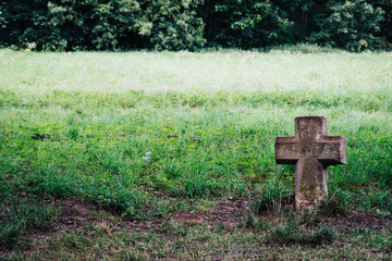 Symbol of a very old cross of a Christian religion in a ground