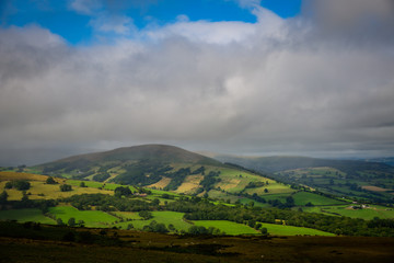 The rain clouds coming over the mountains at the Welsh Countryside in Brecon Beacons, Wales