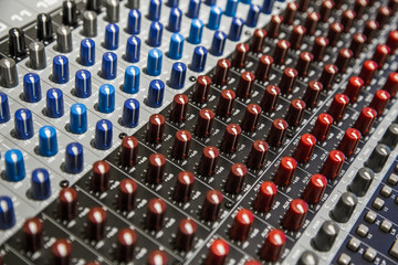 Close-up of the knobs of the mixing console