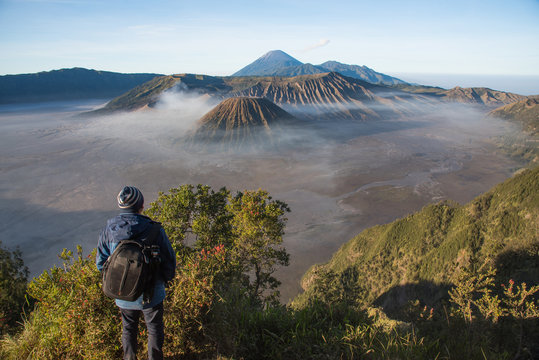 A man traveller looking for a view around lawang village at Mountain BROMO 