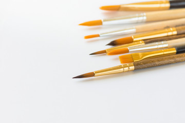 Bunch of Various Kinds of Paint Brushes on White Background. Copy Space for Artwork Lettering Calligraphy Text Inspirational Quote. Creativity Arts Business Product Branding Promotion