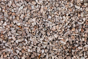 A background of small brown pebbles for landscape design and sprinkle of lawns