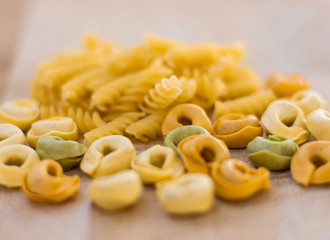 Fusilli Tortellini Pasta on a Wooden Cutting Board