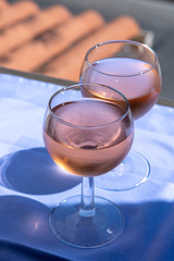 Rose wine of Provence, France, served cold on outdoor terrace in two wine glasses