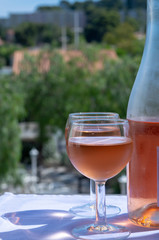 Rose wine of Provence, France, served cold on outdoor terrace in two wine glasses
