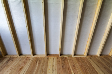 Close-up detail of empty room under construction and renovation with plank oak floor and wooden...