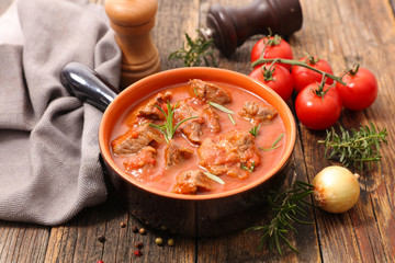 beef cooked with tomato sauce