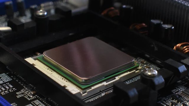Technician remove CPU microprocessor from a motherboard socket.