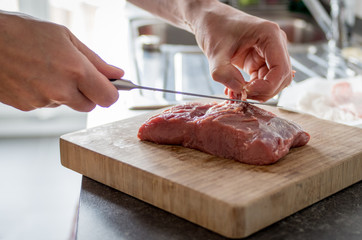 Preparing meat for vitello tonnato
