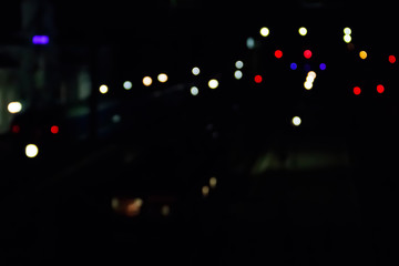 Abstract background of blurred city lights with bokeh effect
