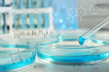 Performing laboratory analysis, closeup. Chemical formulas on background