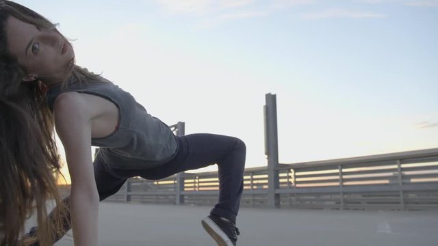 young girl dancing hip hop on a concrete floor 