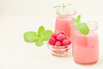 Raspberry smoothie close up photography with fresh summer blended cocktail and ripe berries.