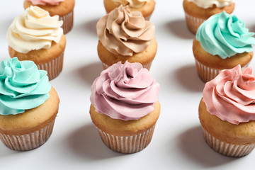 Delicious birthday cupcakes on white background, closeup