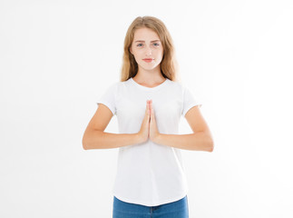 Close-up of hands of pretty woman, girl in white t-shirt , meditating indoors, focus on arms in...