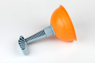 Plunger (plunger) orange for cleaning toilet on white background.