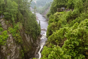 Foto op Canvas QUEBEC CITY, QUEBEC / CANADA - JULY 14 2018: Canyon Ste-Anne at rainy day © Vadim