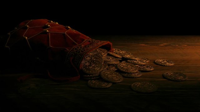 Bag Of Gold Coins In Candlelight