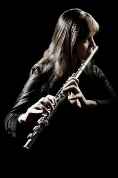 Flute player isolated. Flutist playing music instrument