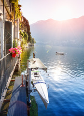Beautiful morning scene with hanging kayak on lake Como in Italy, Europe. Sunrise scenery....