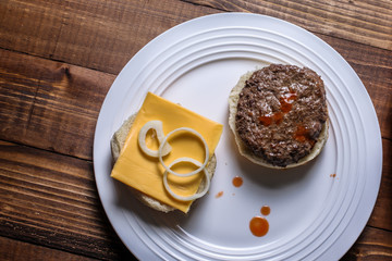 Home made hamburger on white plate