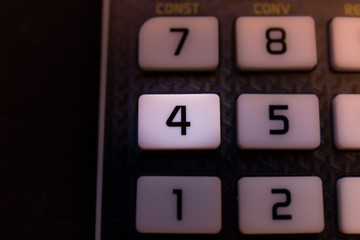 Fototapeta premium Key number four of the keyboard of a scientific calculator