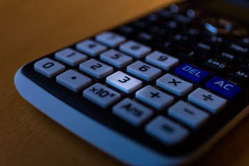 Key number three of the keyboard of a scientific calculator