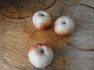 Apples of table.