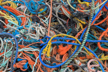 Heap of colorful ropes on pier