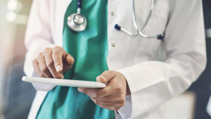 Female doctor using digital tablet
