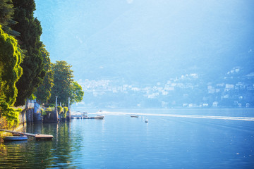 Amazing morning scenery on lake Como in Italy, Lombardy - one of the pretties lakes in Europe and luxury resort. Landscape photography. Vacations background.