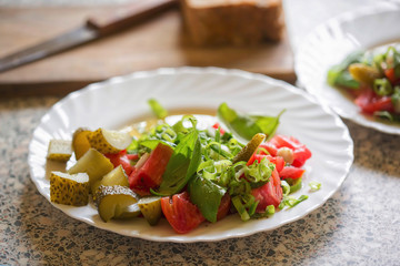Tomato, gherkins, basil & grapes salad with vinaigrette dressing 