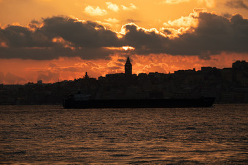 The sun sinking behind the Galata Tower