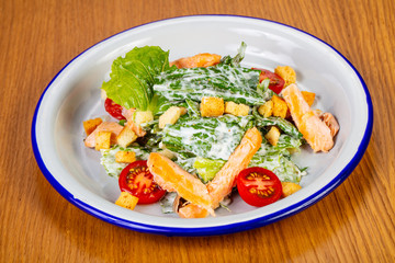 Caesar salad with grilled salmon